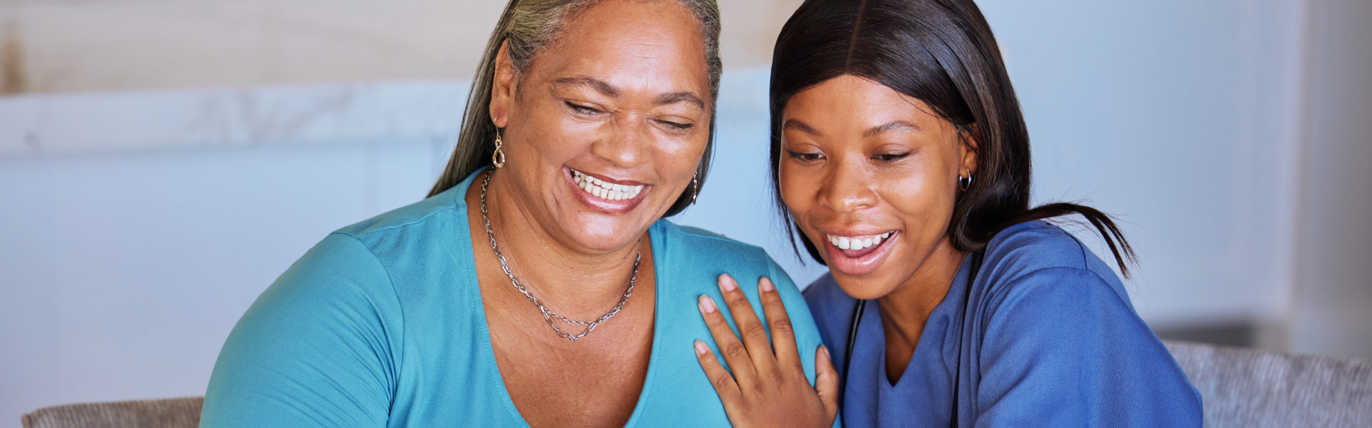 caregiver and her patient smiling