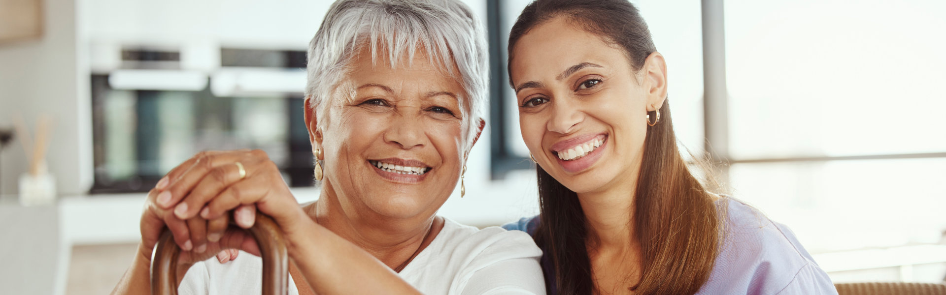 caregiver and her patient smile on the camera