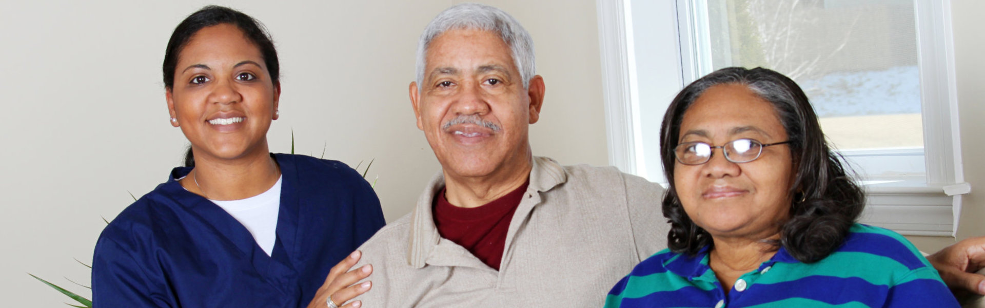 caregiver and her two patients smiling